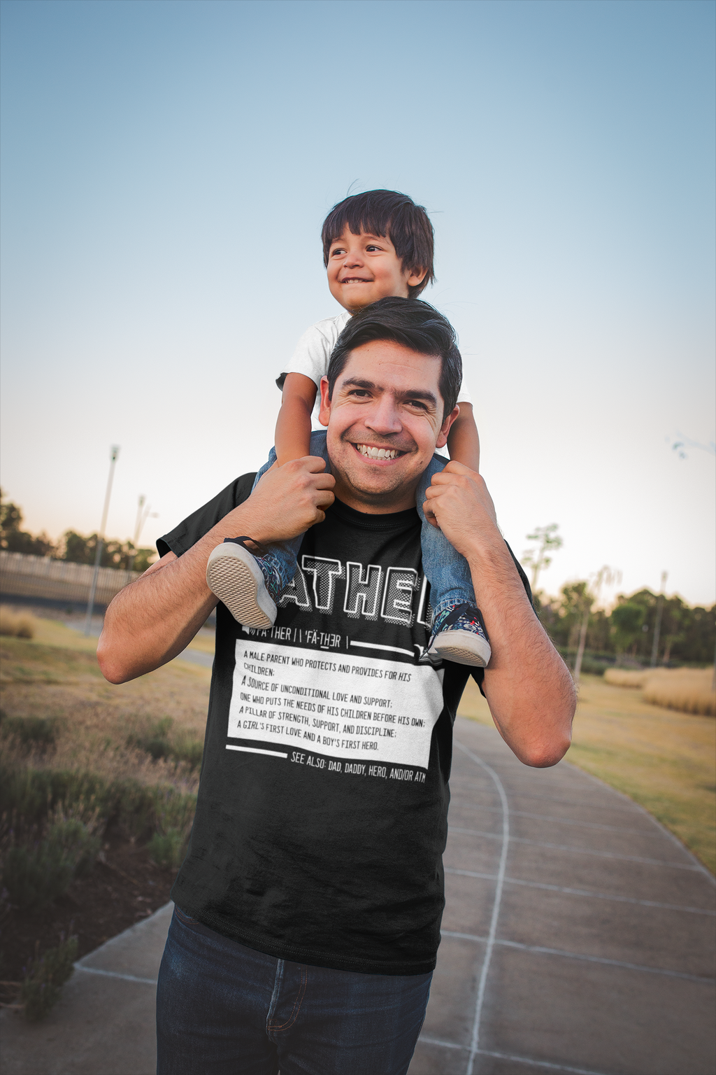 dad-wearing-a-t-shirt-mockup-while-carrying-his-son-a20195
